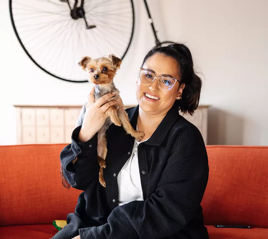 Jess Holding Her Dog And Smiling On Camera | Real Estate Influencer | The Listings Lab