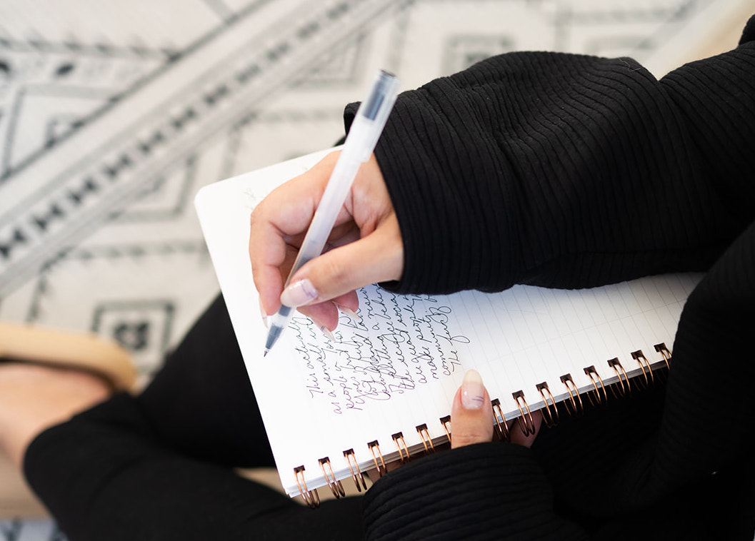 Picture of a Jess Journaling in a Notebook | Limiting Beliefs Real Estate Agents | The Listings Lab