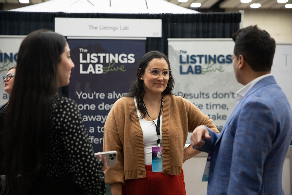 Picture of Jess in the Listings Lab Live Talking To Her Colleagues and Audience